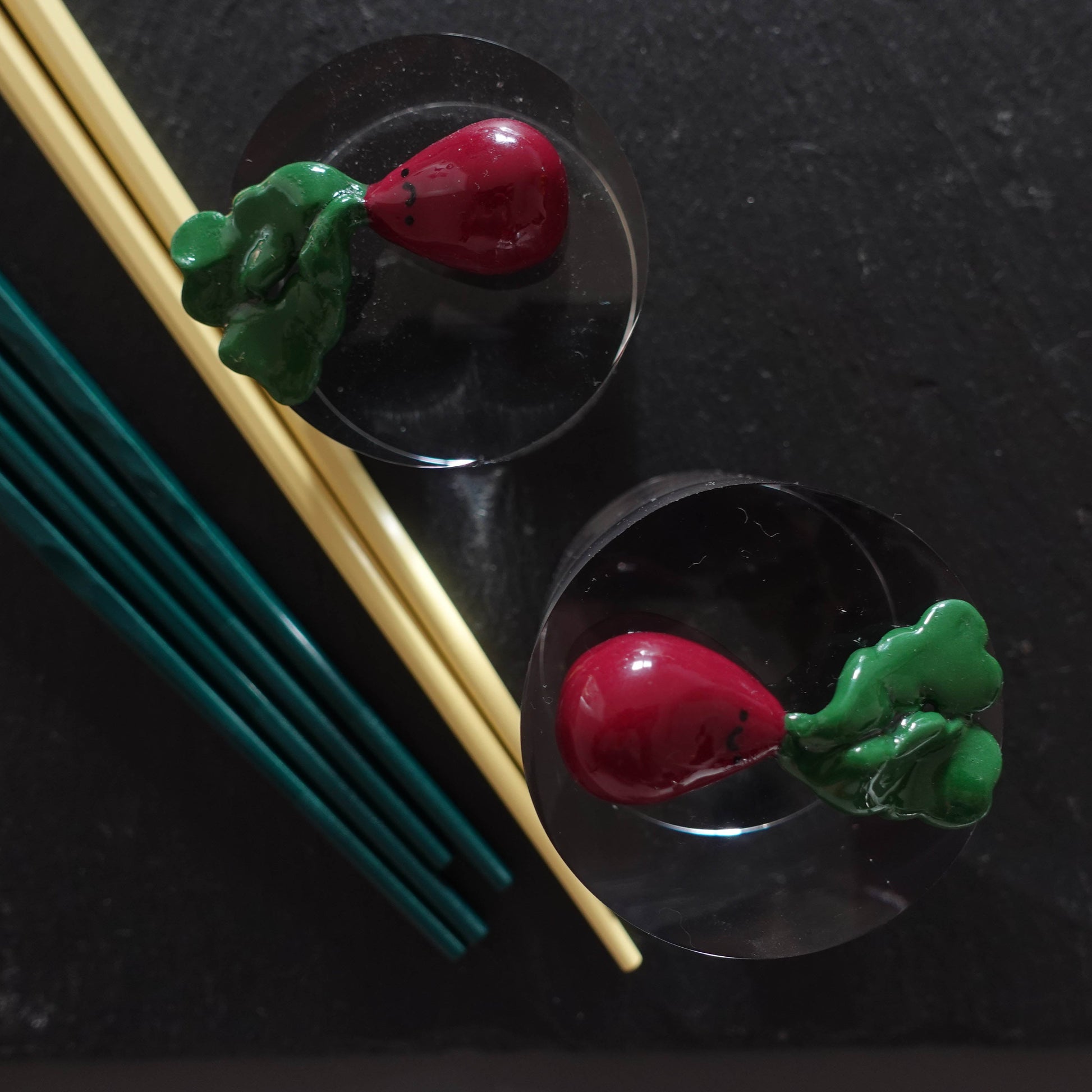Handcrafted beetroot chopstick holder made from polymer clay, featuring vibrant colors and a playful neon pink butthole detail, suitable for use as a pen or brush holder.