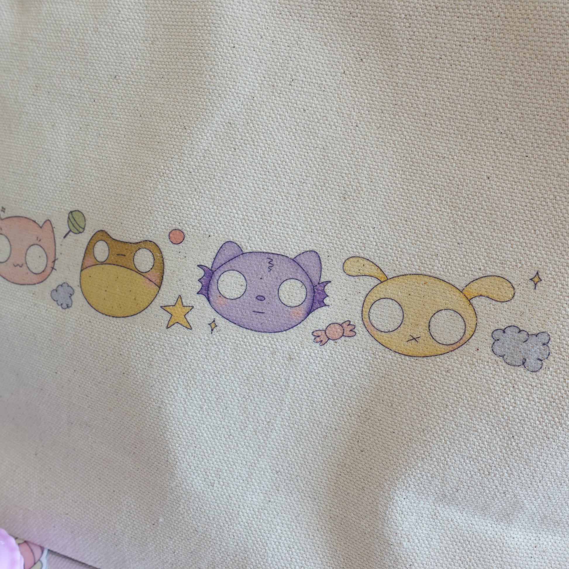Handmade Halloween craft pouch with a kawaii candy-inspired design, paired with an exclusive kawaii Halloween art print from the Midnight Sweets Collection.