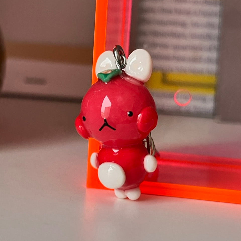 watermelon bunny keychain out of polymer clay and uv resin for durability. an all orange kawaii bunny creature to hang onto your purse, keys or bag or gift for your friends and family