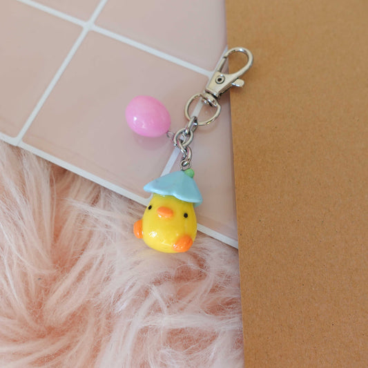 Adorable duckling keychain, featuring a fluffy design that brings a smile wherever you go.