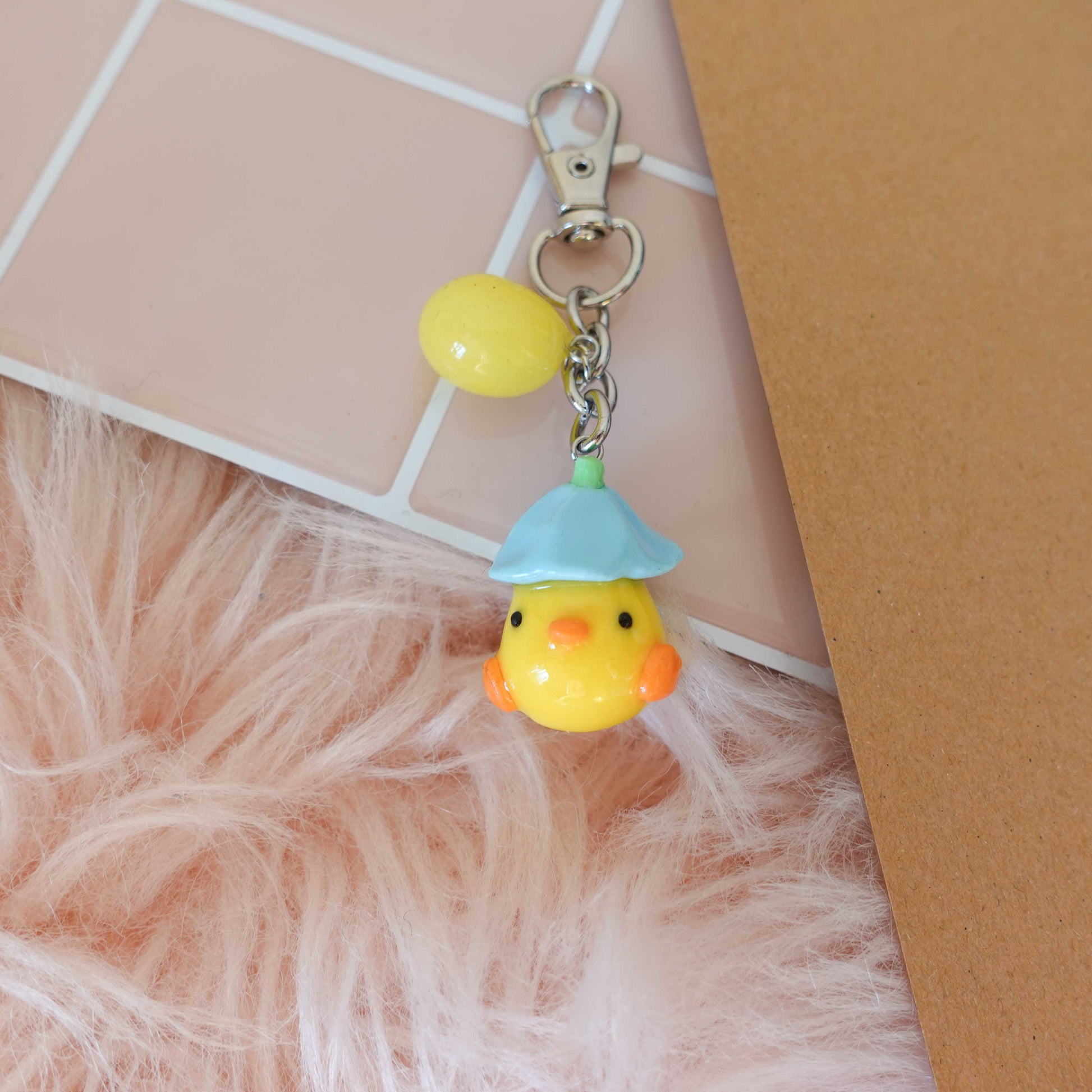 Cute and cuddly duckling keychain, perfect for sprucing up your keys with a touch of spring whimsy.