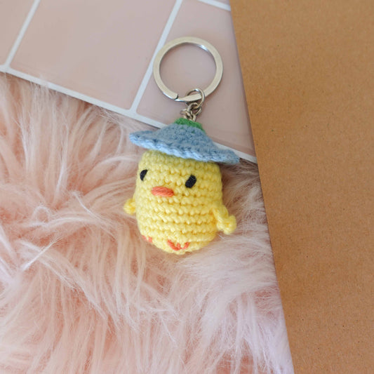 Handcrafted crochet duckling keychain, showcasing unique artistry and soft textures for a delightful touch.