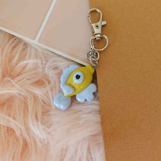 Colorful fish keychain designed with vibrant patterns, perfect for ocean enthusiasts or as a spring gift.