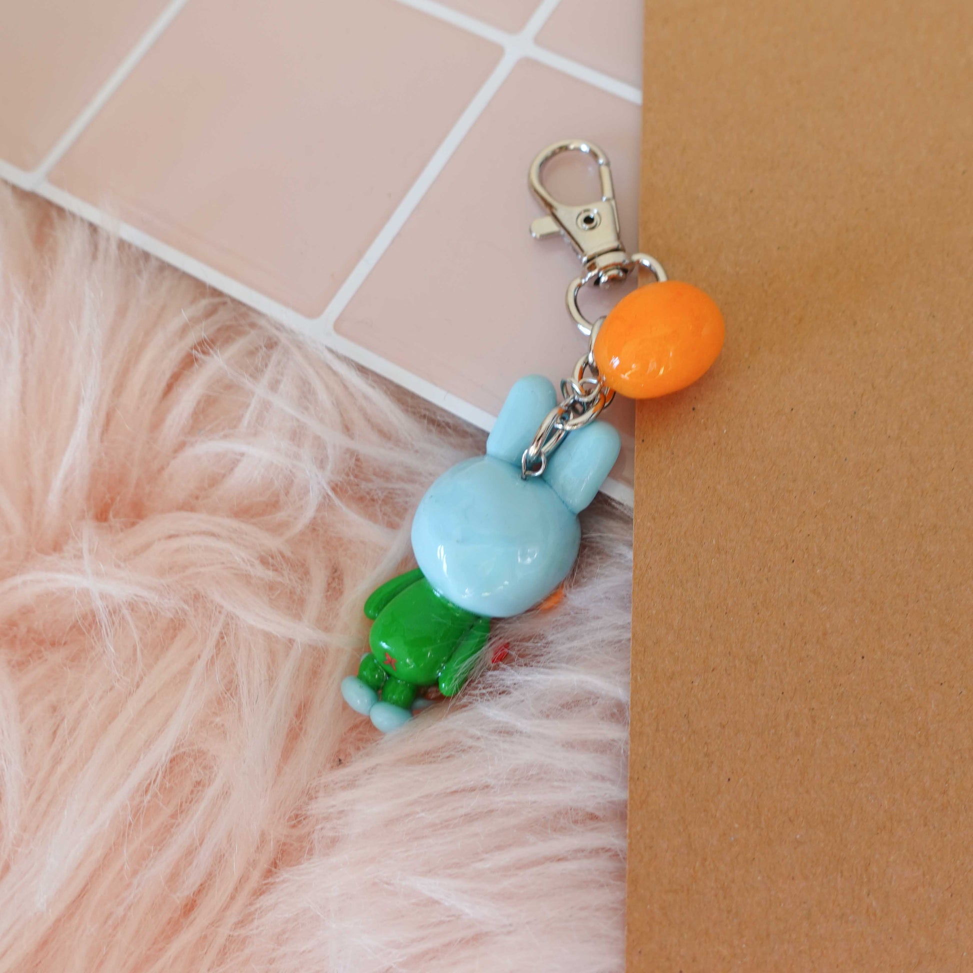 Whimsical frog bunny keychain combining two playful designs into one adorable accessory ideal for spring.