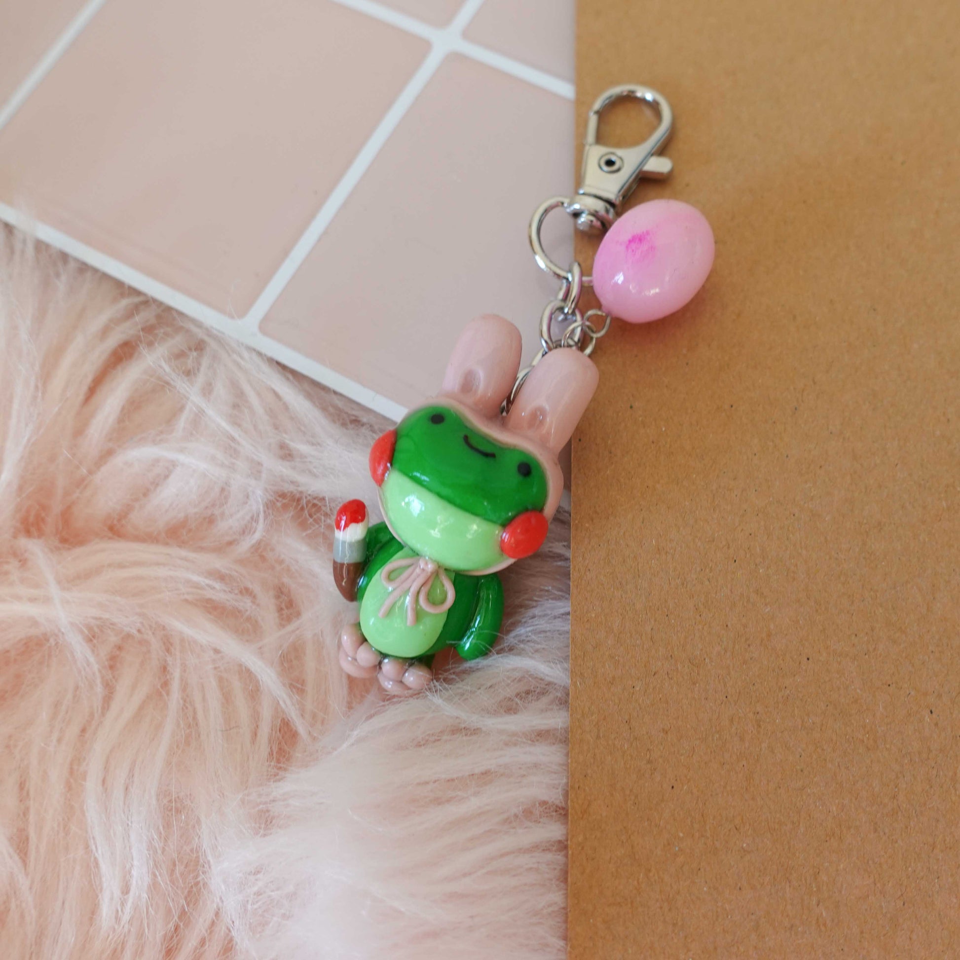 Adorable frog bunny keychain that adds a touch of charm and fun to your keyring or bag.