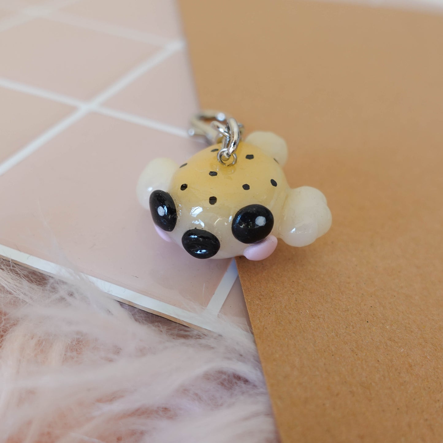 Playful blowfish keychain featuring a colorful design, perfect for nautical-themed accessories.