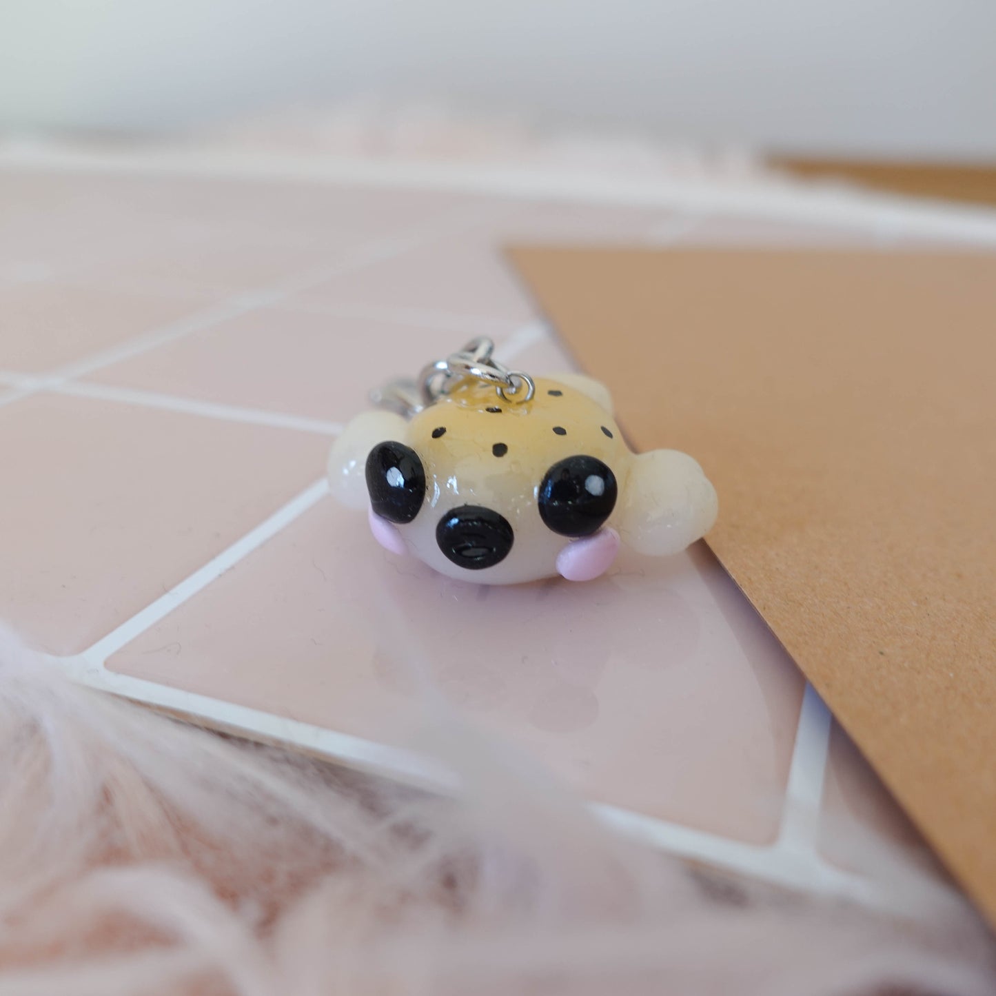 Charming blow fish keychain that brings a touch of fun and ocean inspiration to your everyday carry.