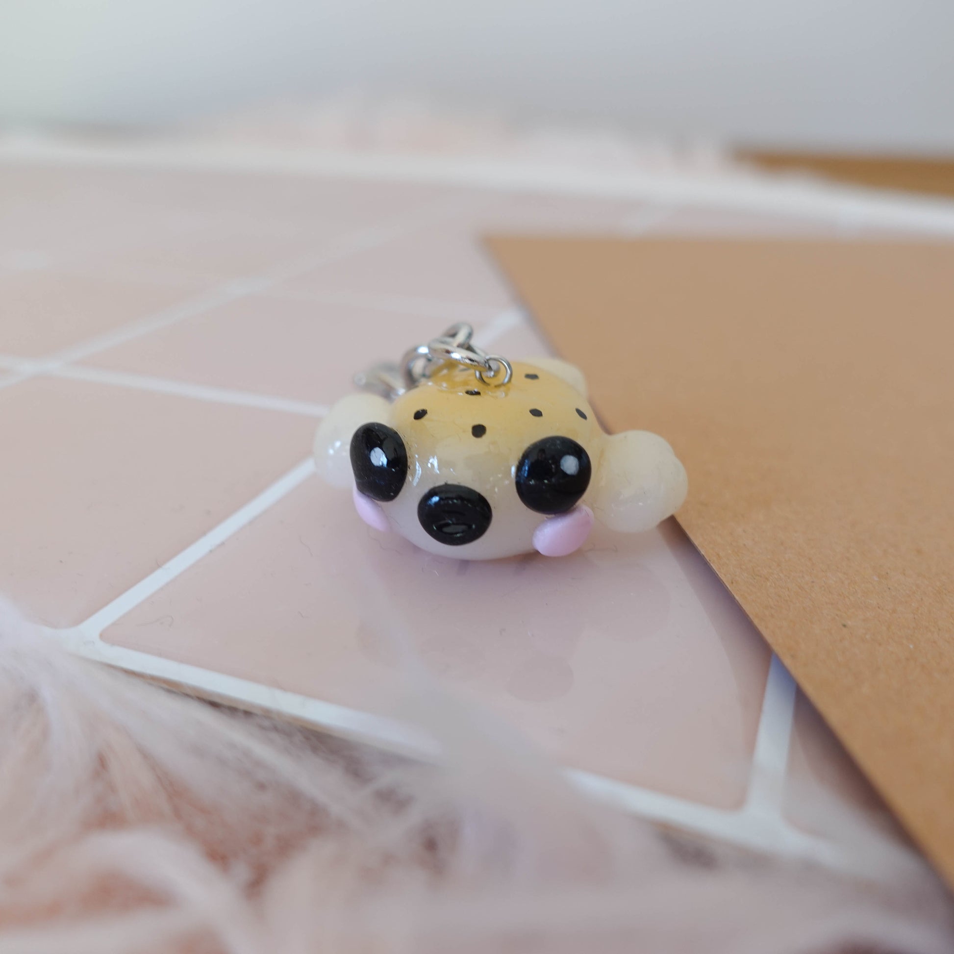Charming blow fish keychain that brings a touch of fun and ocean inspiration to your everyday carry.