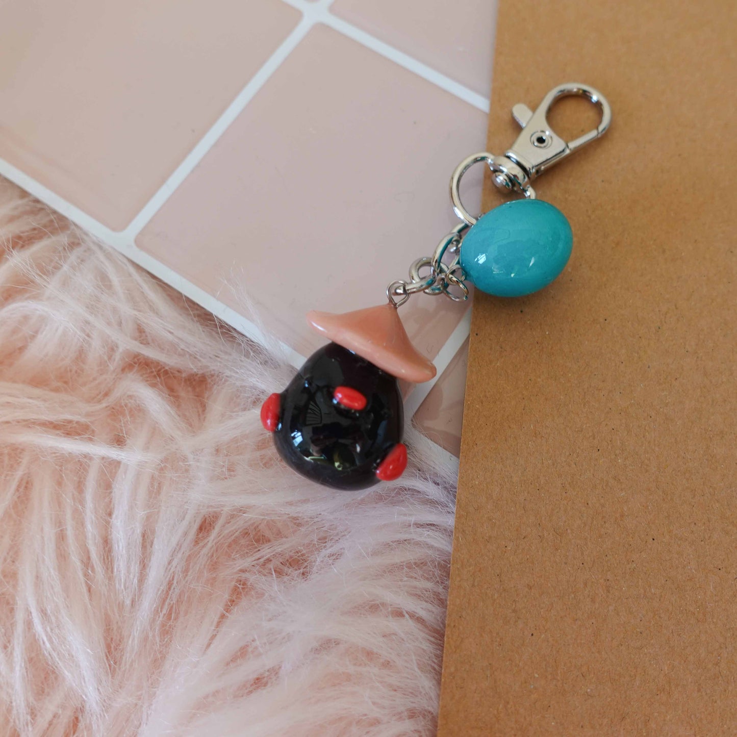 Adorable black duckling keychain, featuring a fluffy design that brings a smile wherever you go.