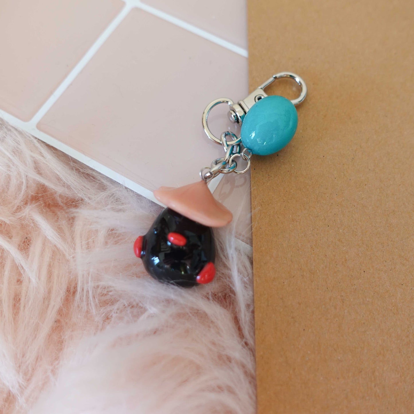 Adorable black duckling keychain, featuring a fluffy design that brings a smile wherever you go.