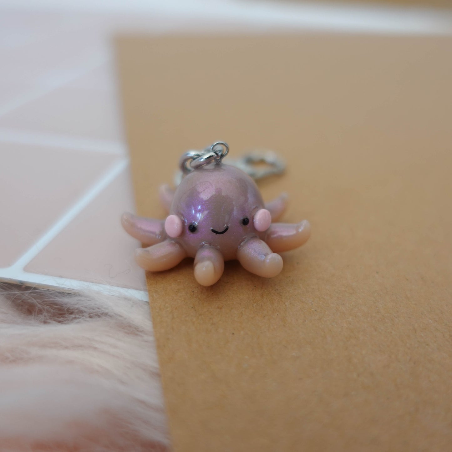 Playful octopus keychain featuring fun colors and an engaging design, ideal for personalizing bags or keys.