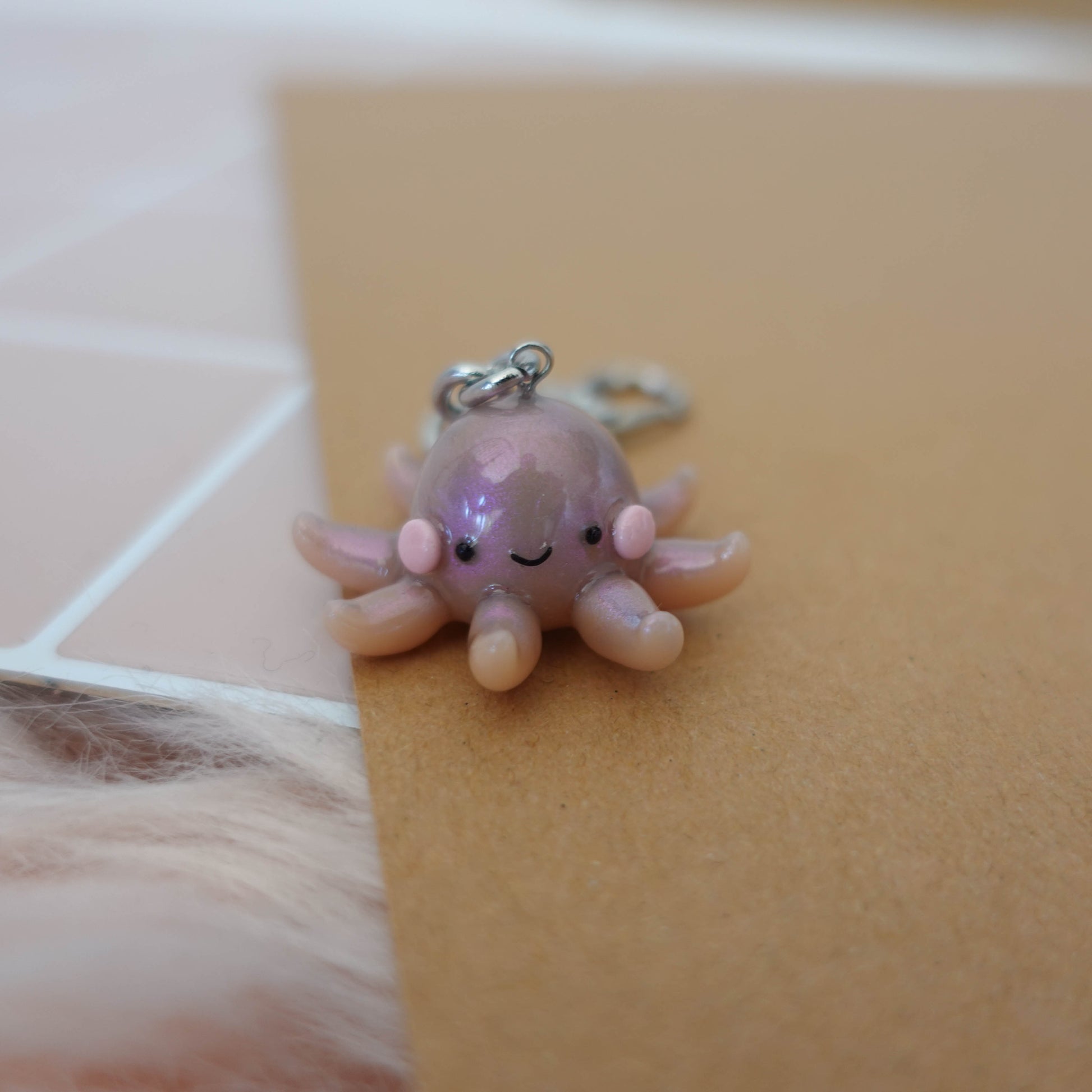 Playful octopus keychain featuring fun colors and an engaging design, ideal for personalizing bags or keys.