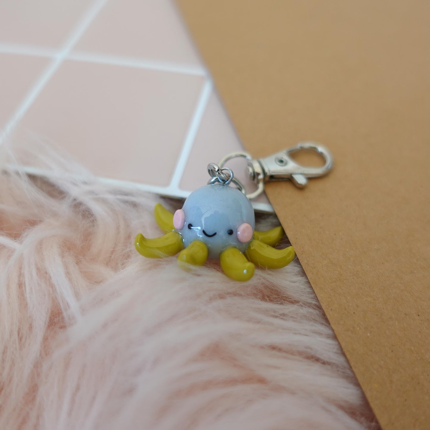 Playful octopus keychain featuring fun colors and an engaging design, ideal for personalizing bags or keys.