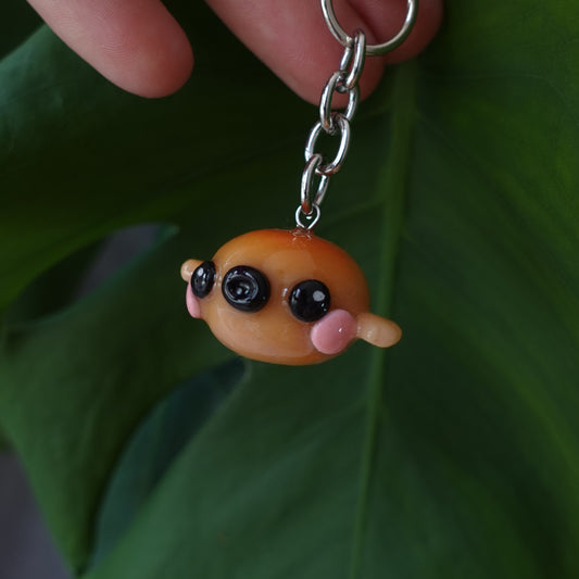 Playful blowfish keychain featuring a colorful design, perfect for nautical-themed accessories.