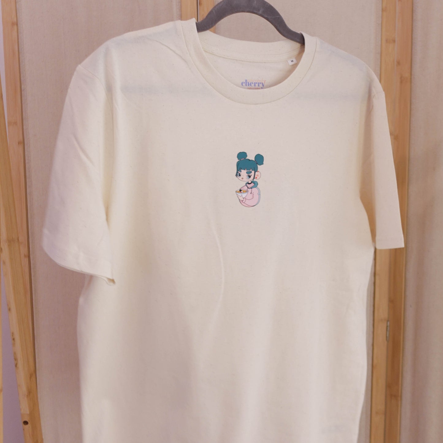 Organic cotton graphic T-shirt featuring the original Ramen Girl illustration in Raw Natural.