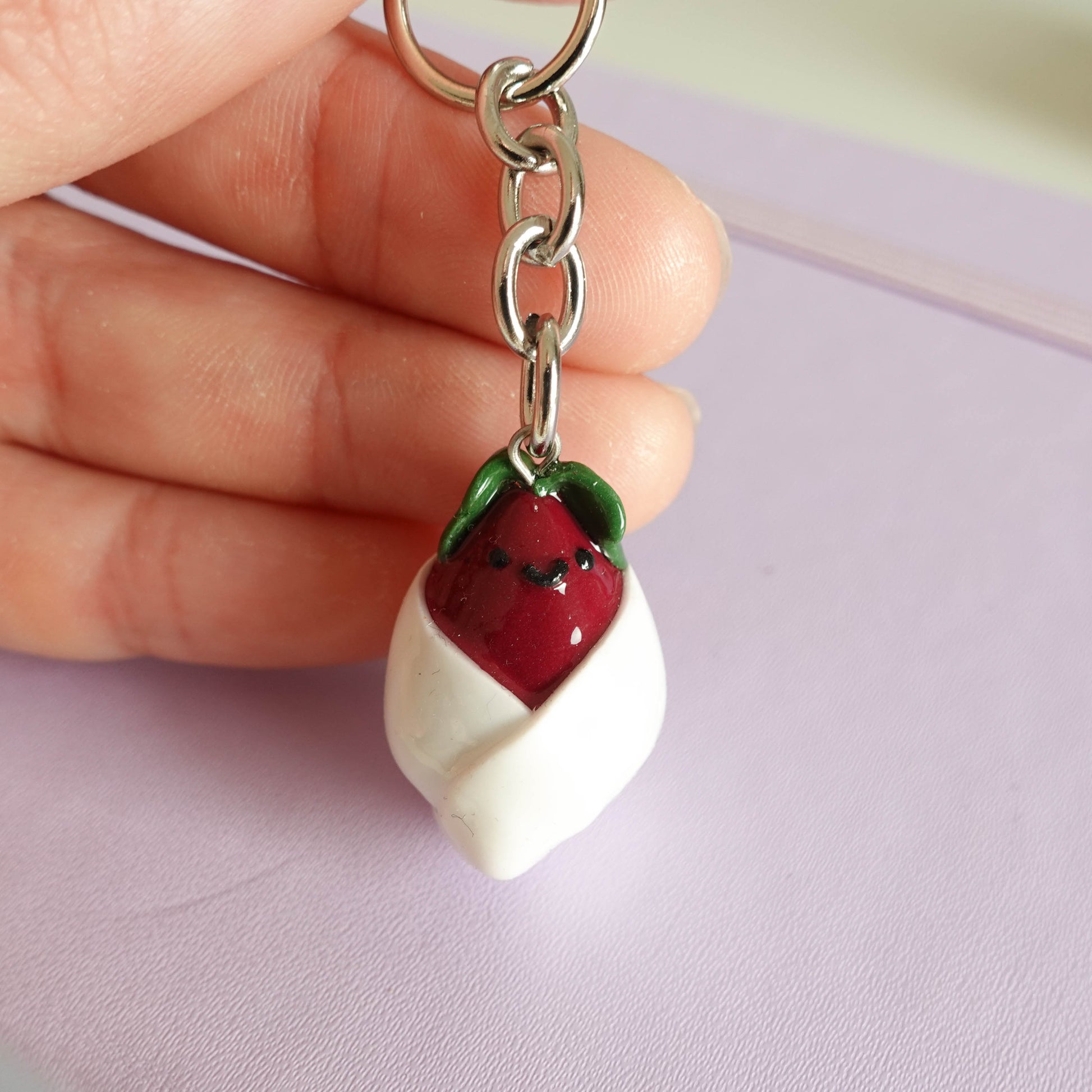 Handcrafted beetroot keychain made from polymer clay, featuring vibrant colors and a whimsical design, perfect for adding a touch of charm to your keys.