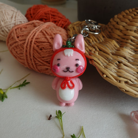 Strawbun Keychain: A pink bunny wearing a strawberry hat, a whimsical accessory for your keys or bag.