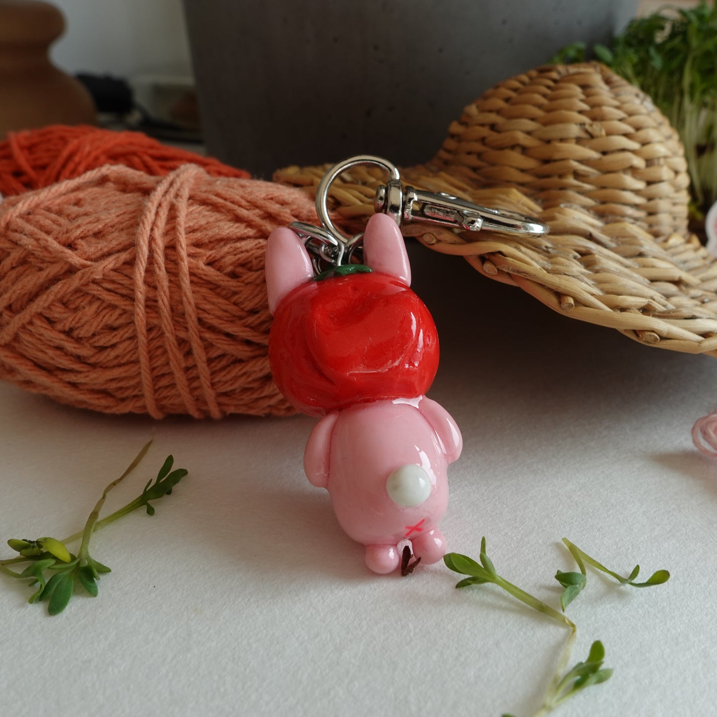 Strawbun Keychain: A pink bunny wearing a strawberry hat, a whimsical accessory for your keys or bag.