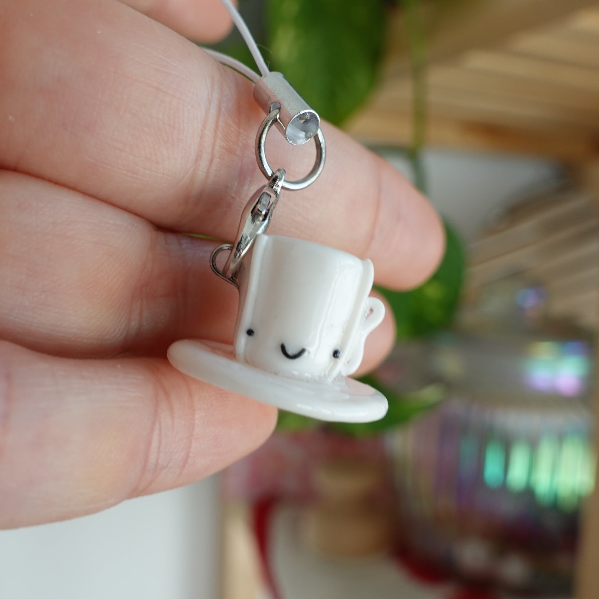 Tea Cup Phone Charm: A miniature tea cup charm, adding a touch of elegance to your phone accessory.