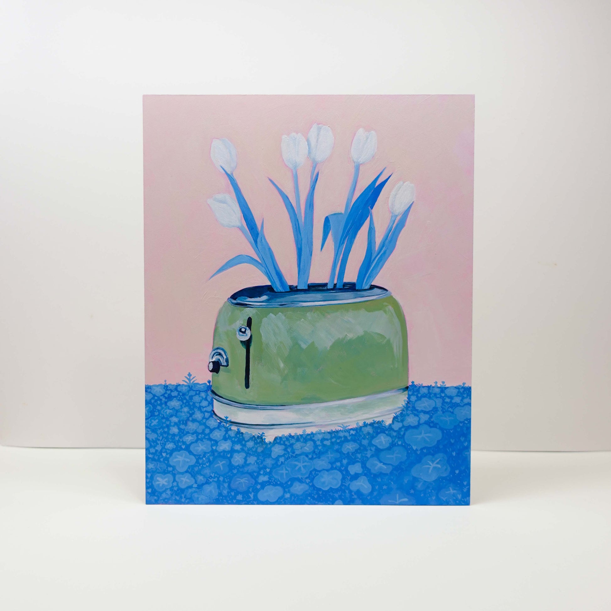 Surreal painting of tulips growing out of a toaster, with plants spreading across the ground, acrylic on wood, 24 × 30 cm