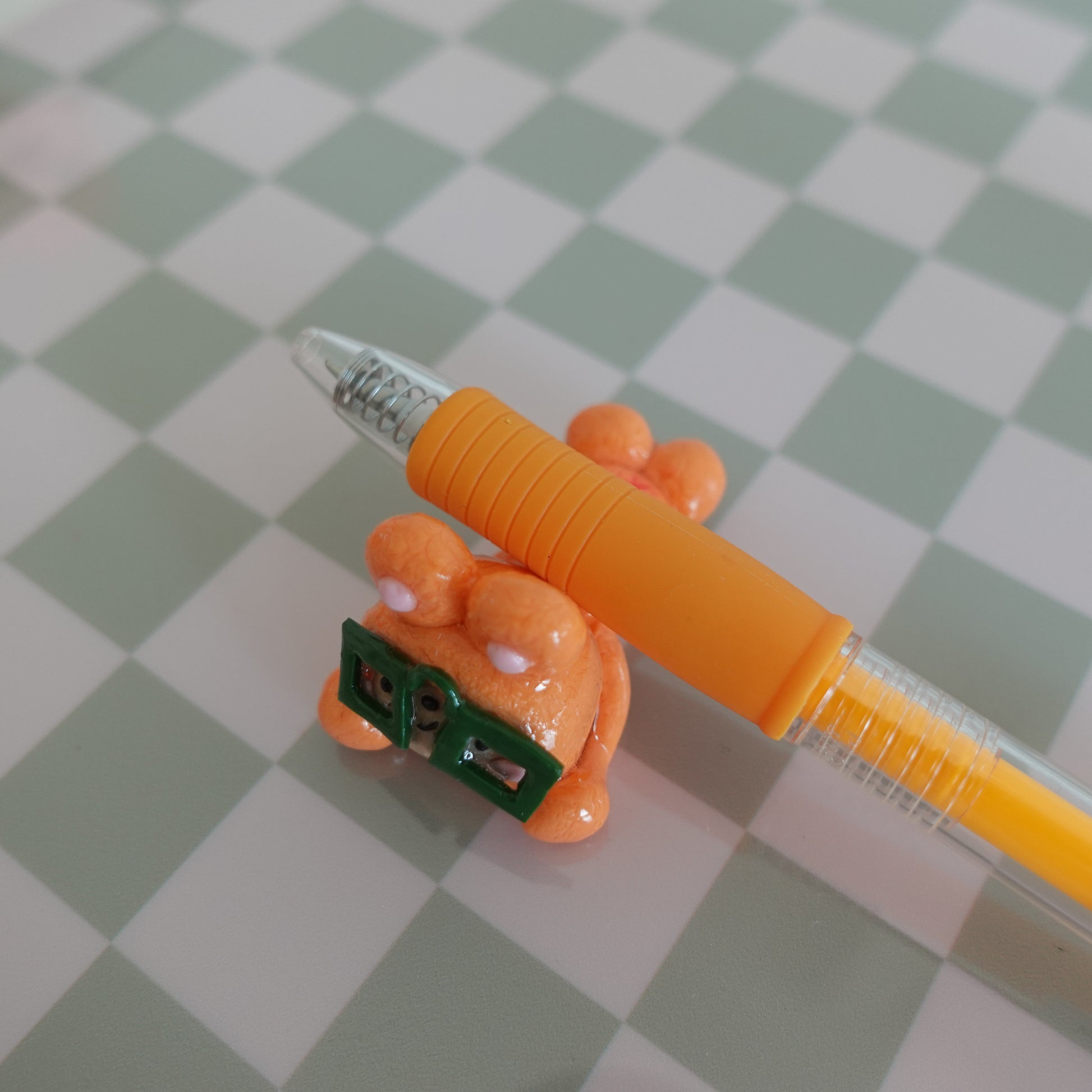 Nerdy desk friend with pens and chopsticks inserted, demonstrating its use as a multi-functional desk accessory.