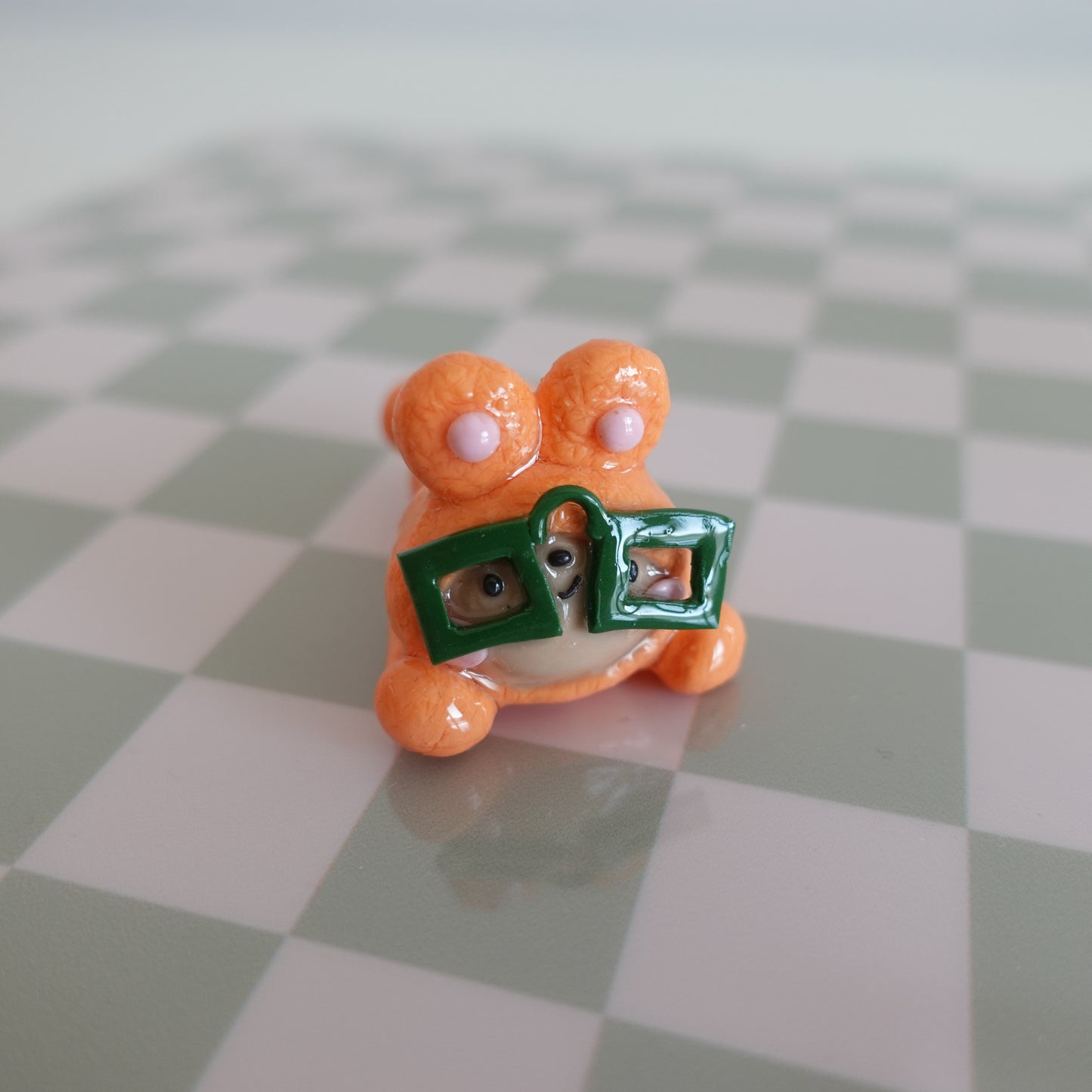 Nerdy desk friend on a desk, holding pens and chopsticks, showcasing its dual functionality and charming design.