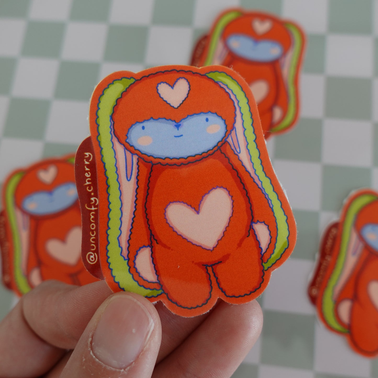 Close-up of the Fluff Club glossy vinyl stickers, emphasizing their shiny finish and vibrant colors.