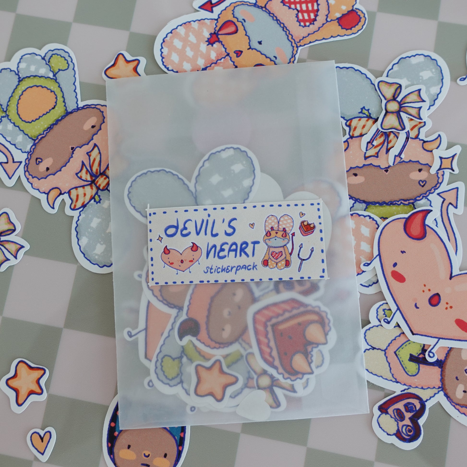 Close-up of individual stickers from the Fluff Club Devil's Heart pack, featuring vibrant colors and playful devil-themed designs.