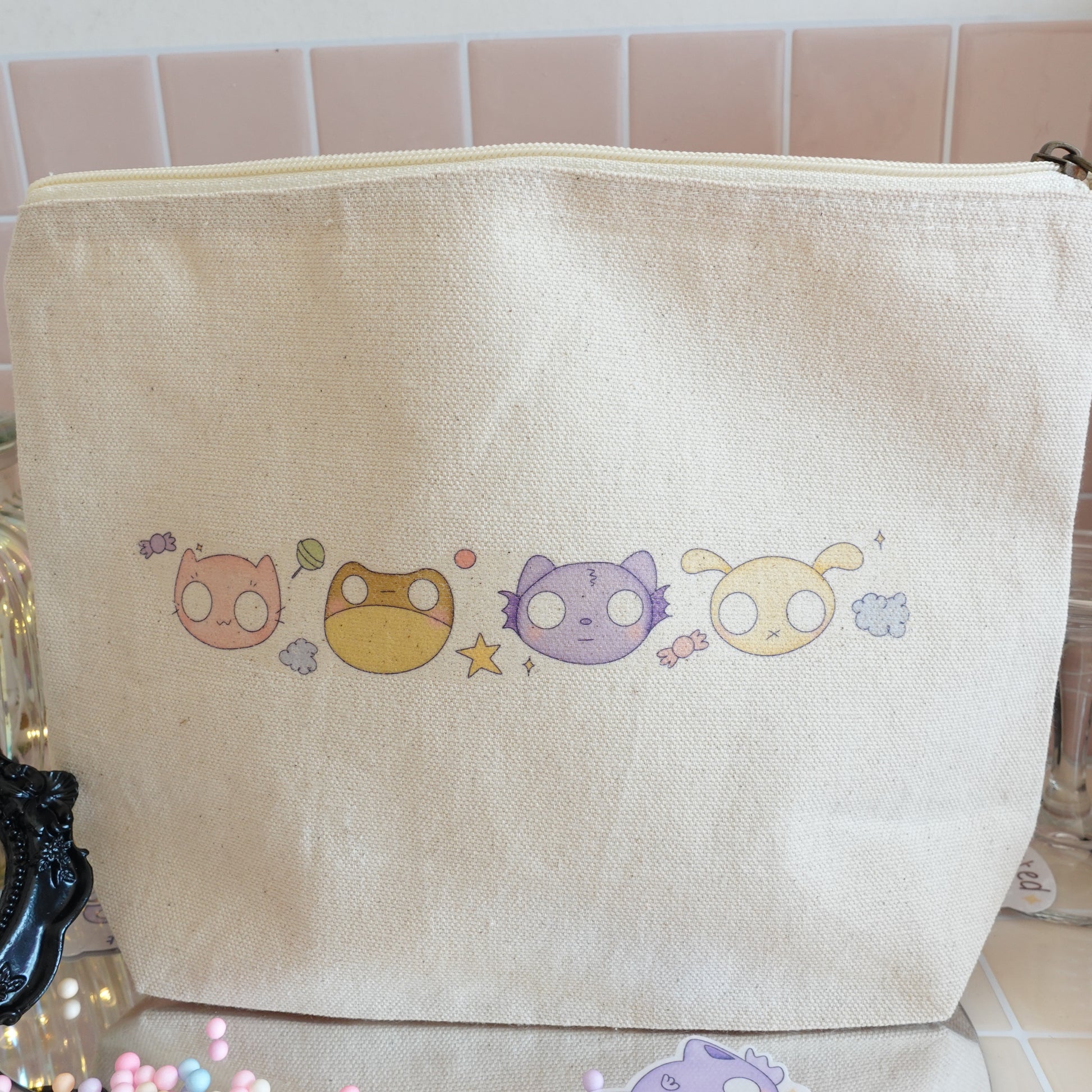 Handmade Halloween craft pouch with a kawaii candy-inspired design, paired with an exclusive kawaii Halloween art print from the Midnight Sweets Collection.