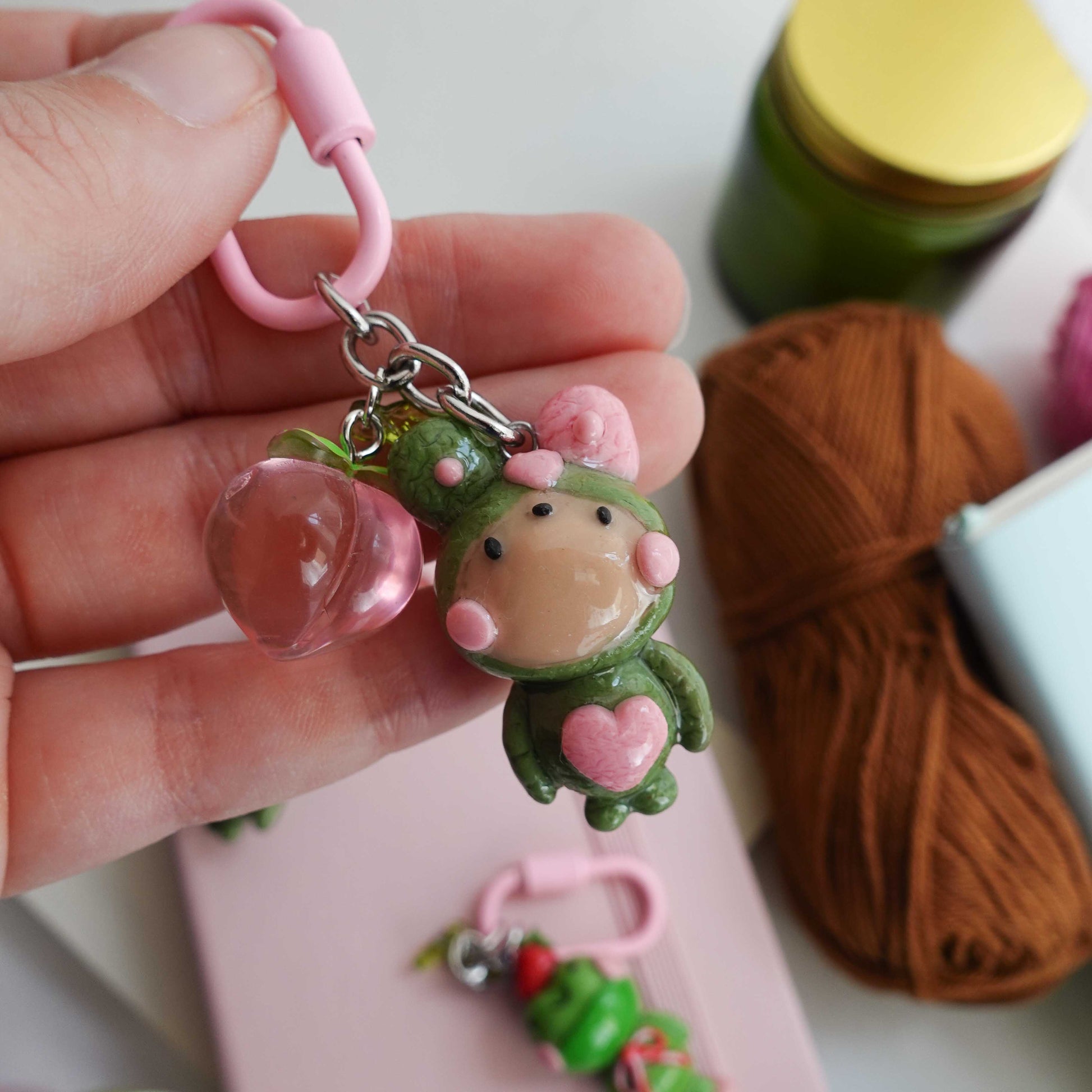 matcha fluff club keychain with a pink keychain