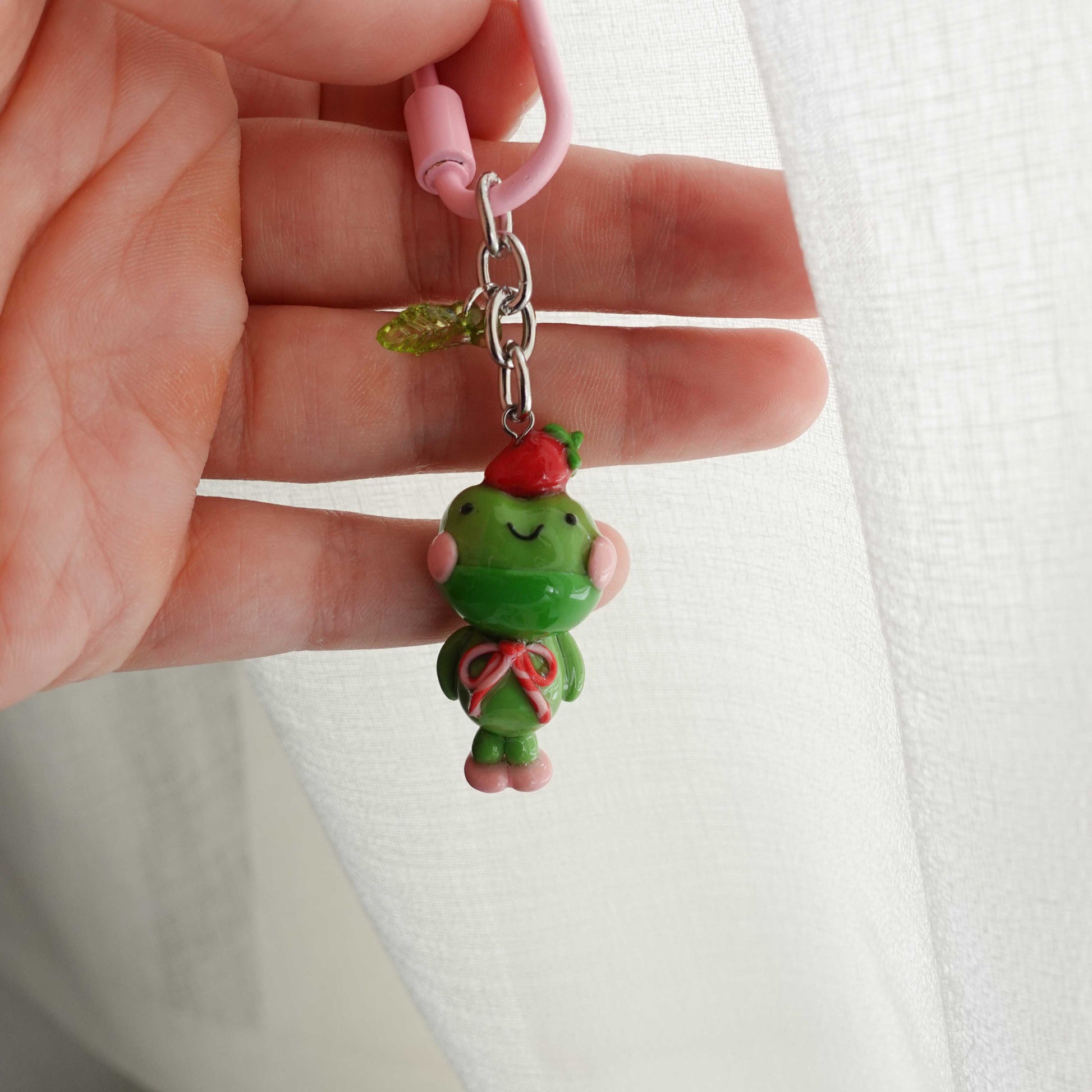 matcha frog keychain with a strawberry on head