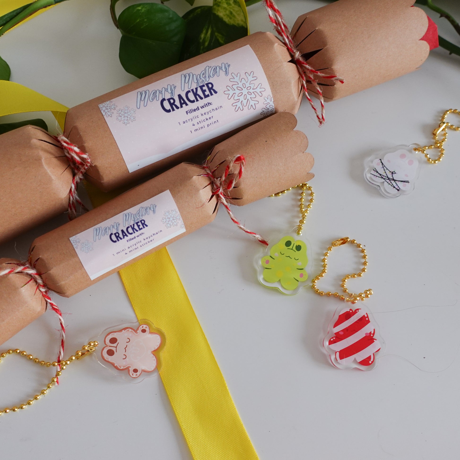 picture of all mystery christmas crackers which are perfect as a holiday gift, a christmas present for your friends and family or if you want to make yourself happy as well. all four keychains you are able to get in one of the mystery bag are shown in this picture