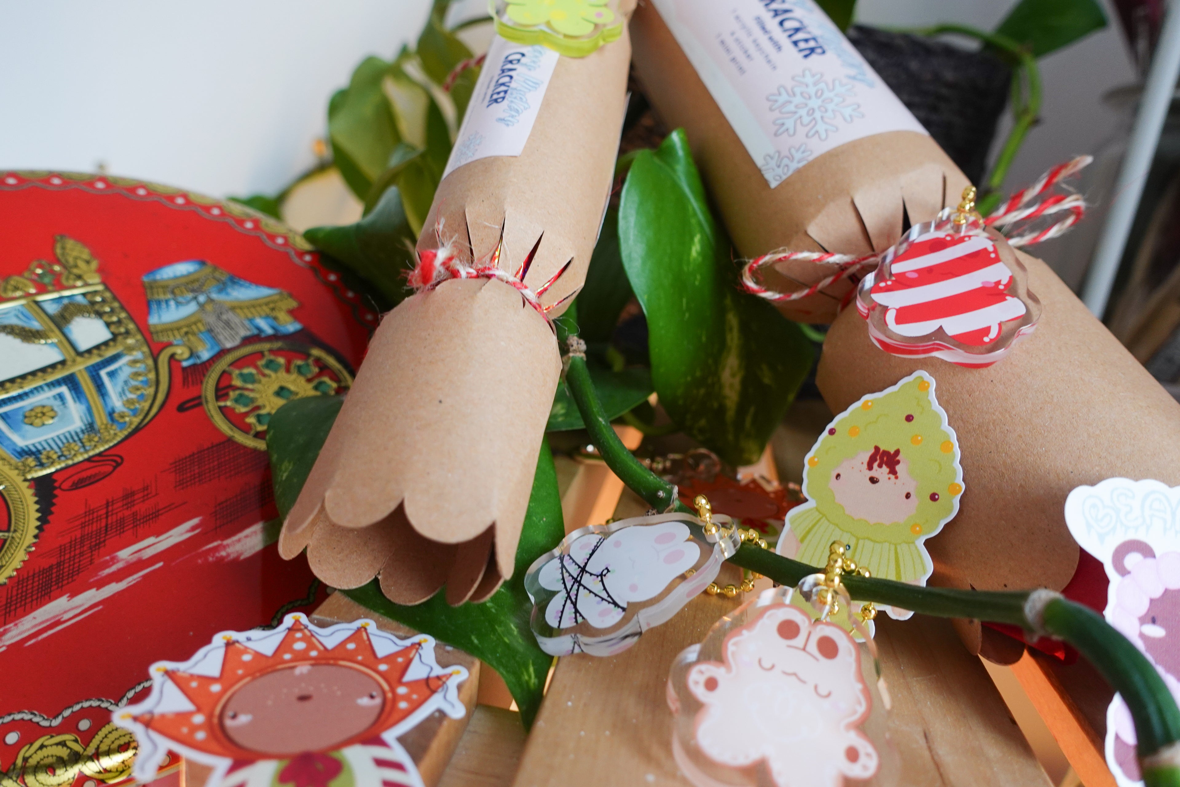 picture of the christmas collection including mystery bags in the form of christmas crackers, stickers, acrylic keychains and more, perfect as a gift for friends and family or for yourself