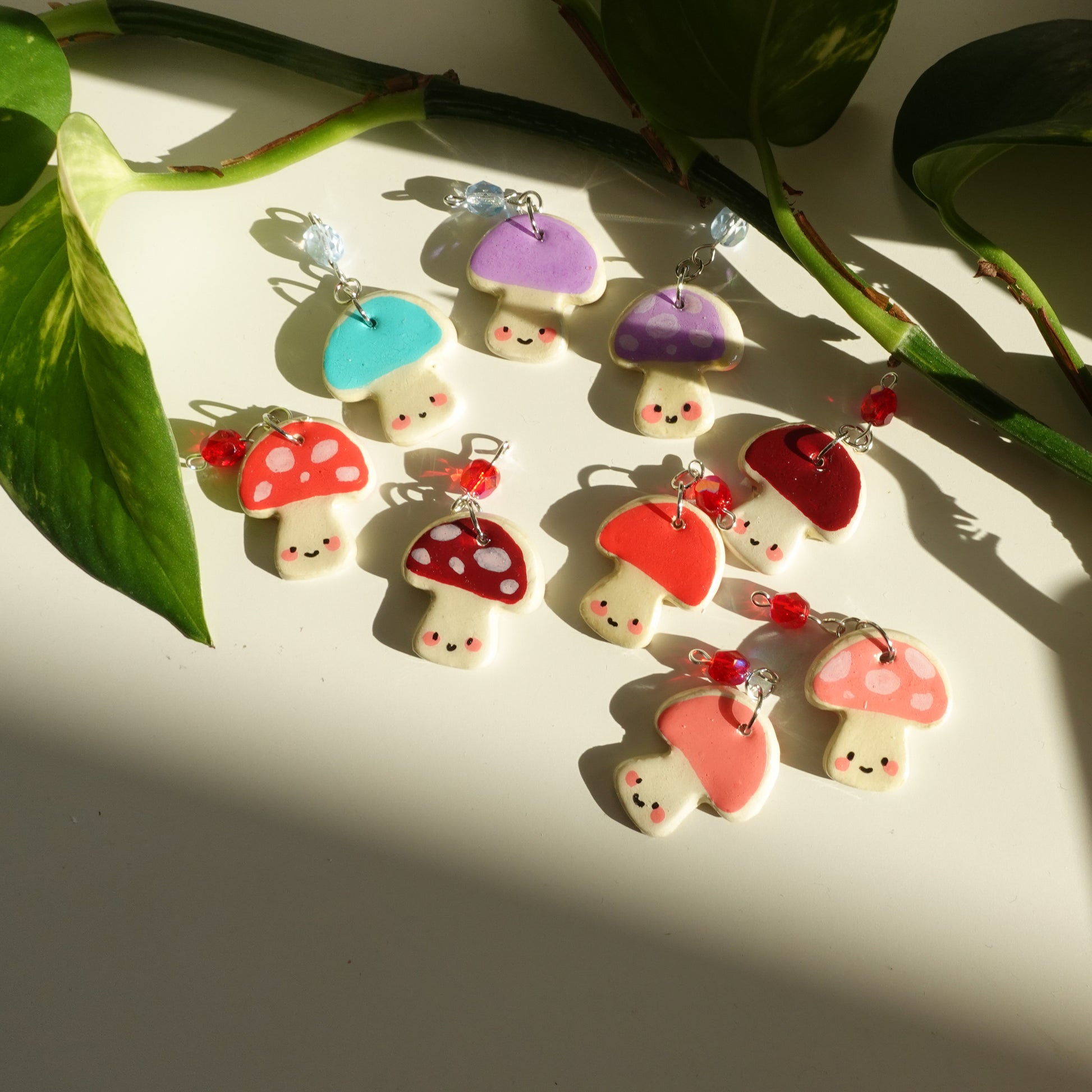 mushroom lucky charm keychain in various colors with a bead for extra added sparkle. clay charm resined to make them durable. perfect new years gift or present for the holidays to any kawaii lover and mushroom lover