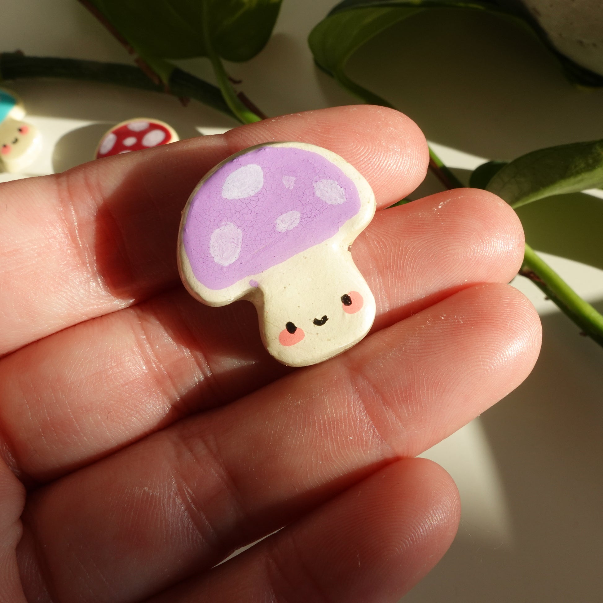 mushroom lucky charm magnets in lilac with dots. clay charm resined to make them durable. perfect new years gift or present for the holidays to any kawaii lover and mushroom lover