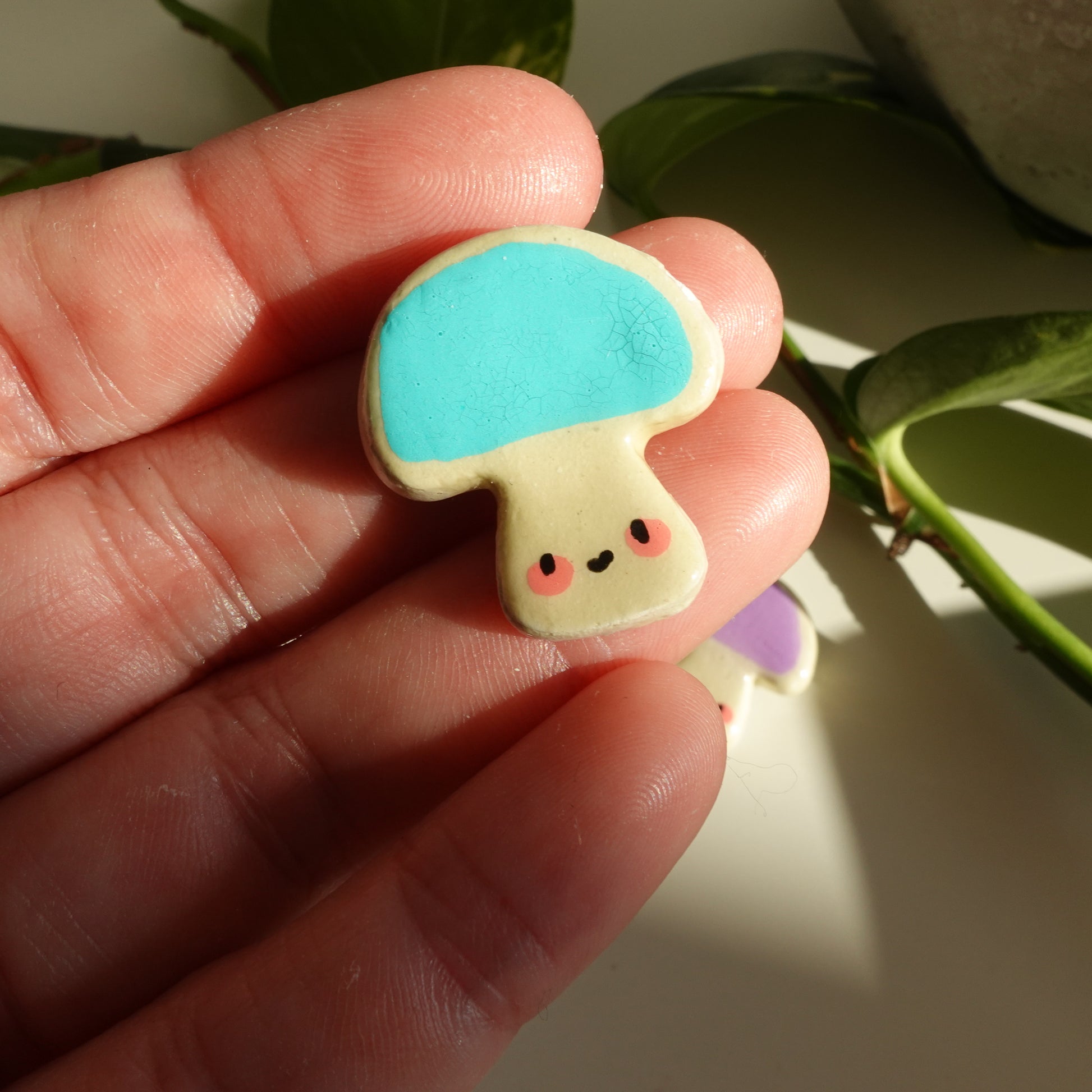 mushroom lucky charm magnets in teal. clay charm resined to make them durable. perfect new years gift or present for the holidays to any kawaii lover and mushroom lover