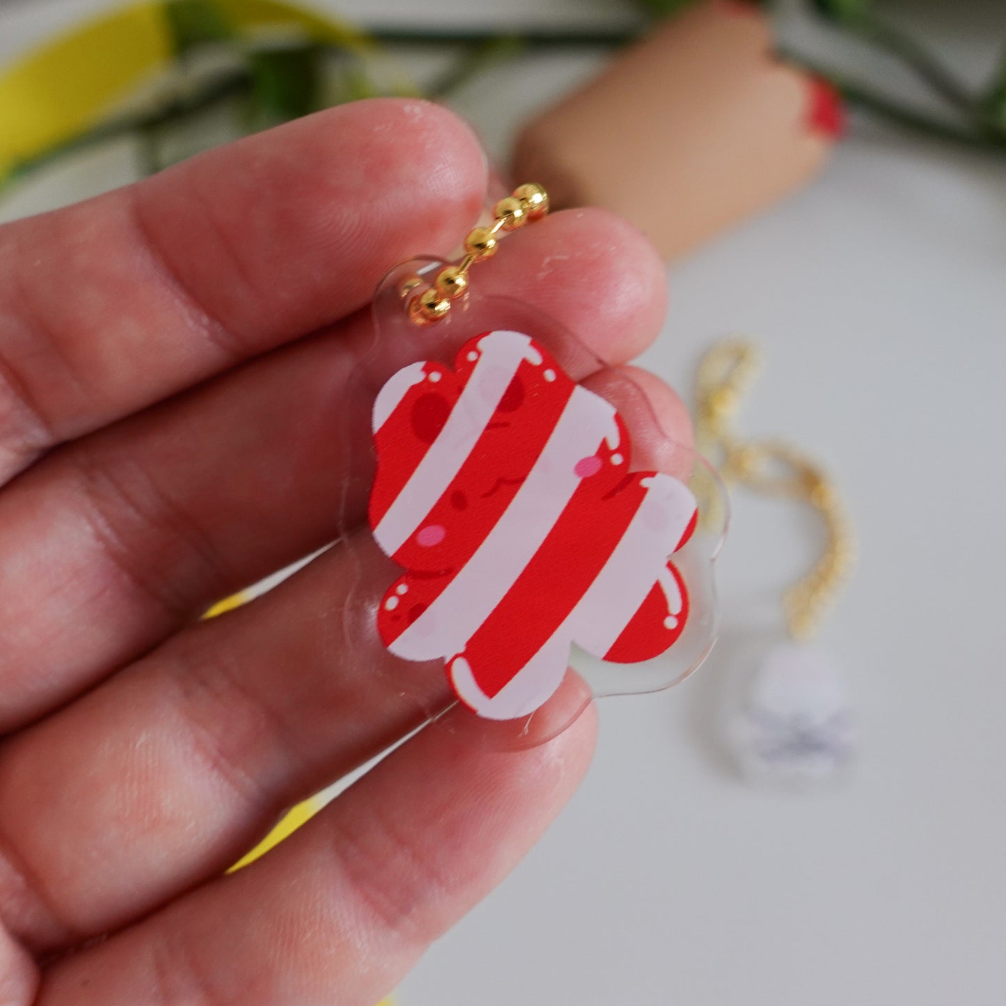 picture of one of the acrylic keychains which is a christmas candy cane bunny in kawaii style