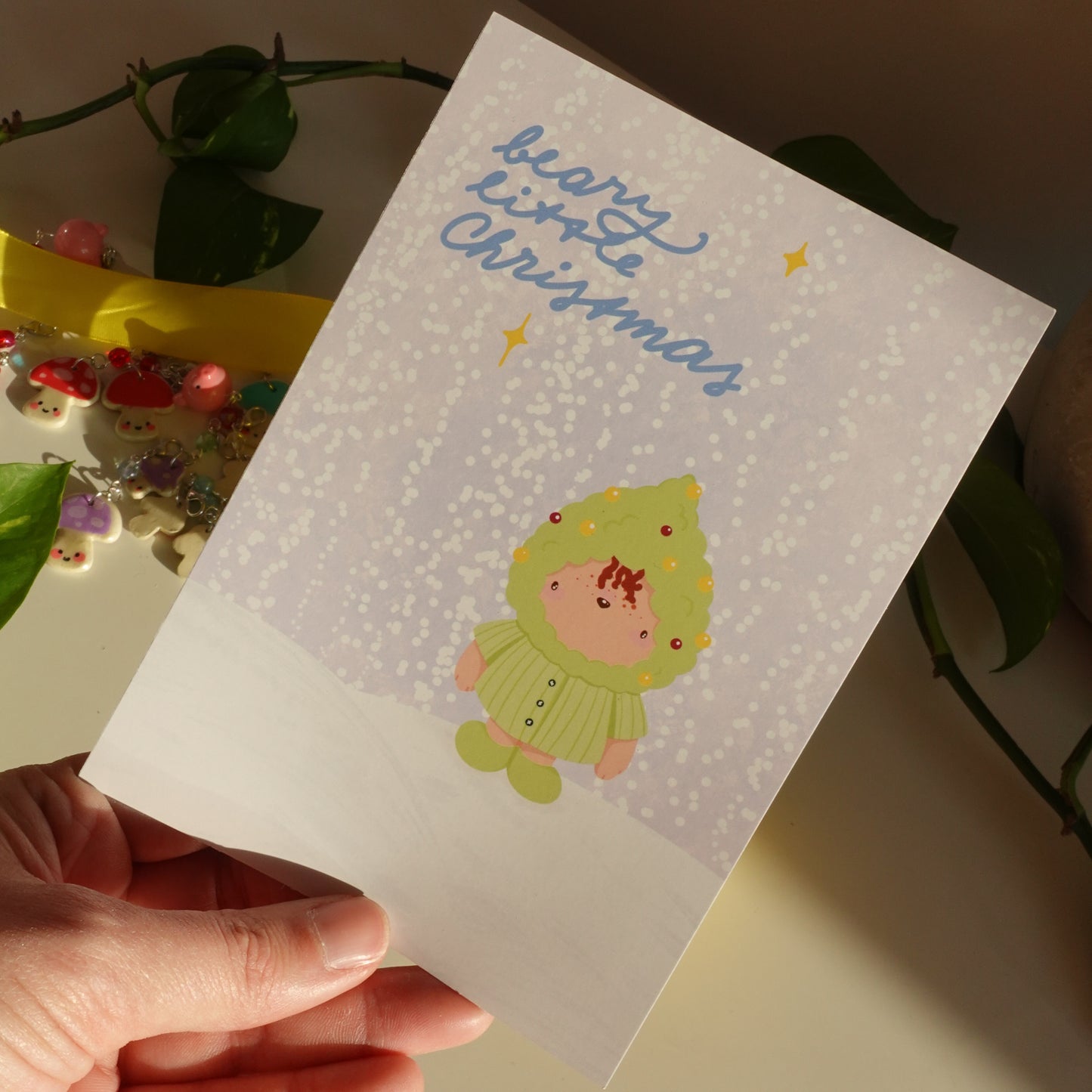 christmas card or christmas print to celebrate the season with a little bear looking like a decorated christmas tree and the text beary little christmas