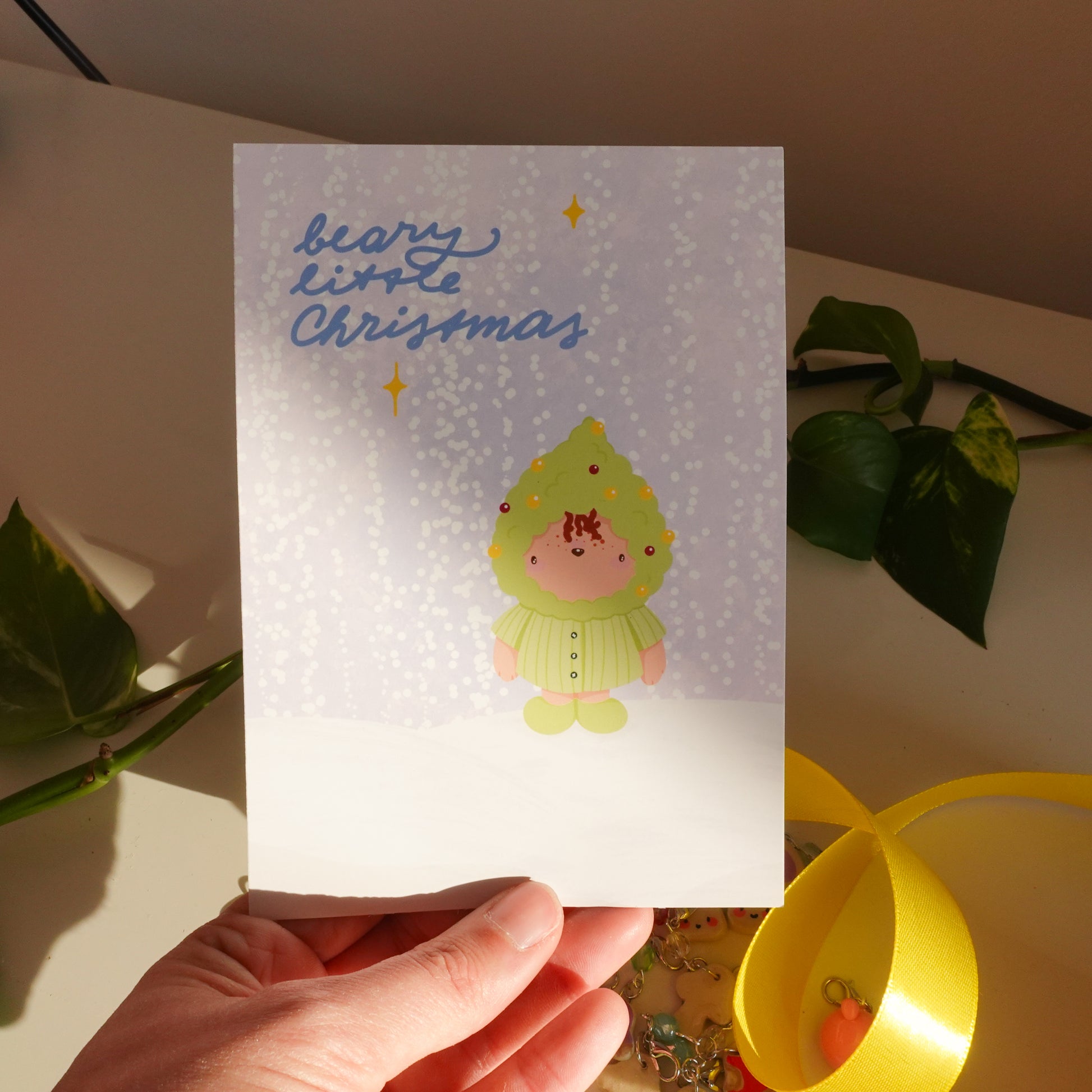 christmas card or christmas print to celebrate the season with a little bear looking like a decorated christmas tree and the text beary little christmas