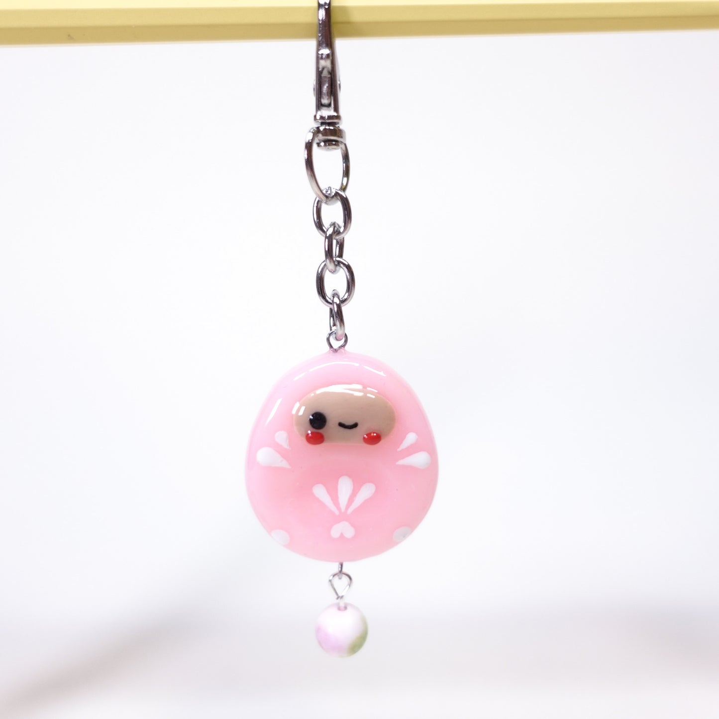 Red Daruma worry stone keychain for grounding and stress relief