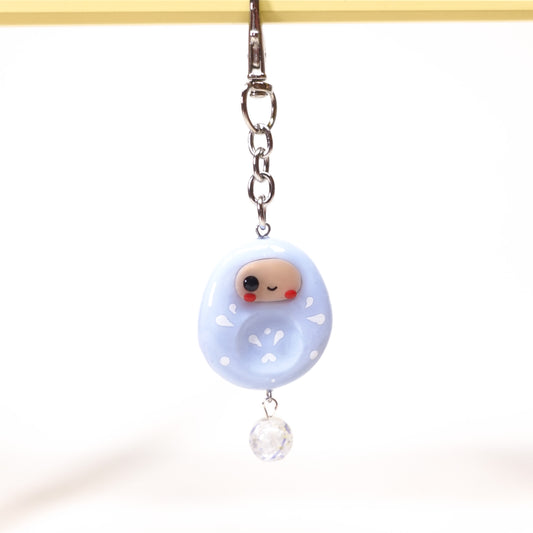 Japanese-inspired Daruma keychain with smooth worry stone texture