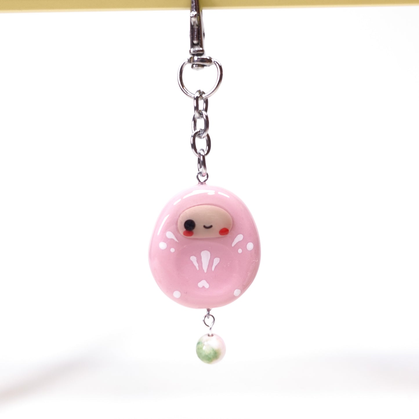 Lucky Daruma charm keychain designed as a calming fidget accessory