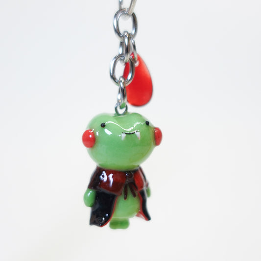Mr. Frog Dracula kawaii Halloween keychain, handmade polymer clay vampire frog with Dracula cape and spooky details, part of the Midnight Picnic collection by Uncomfy Cherry.