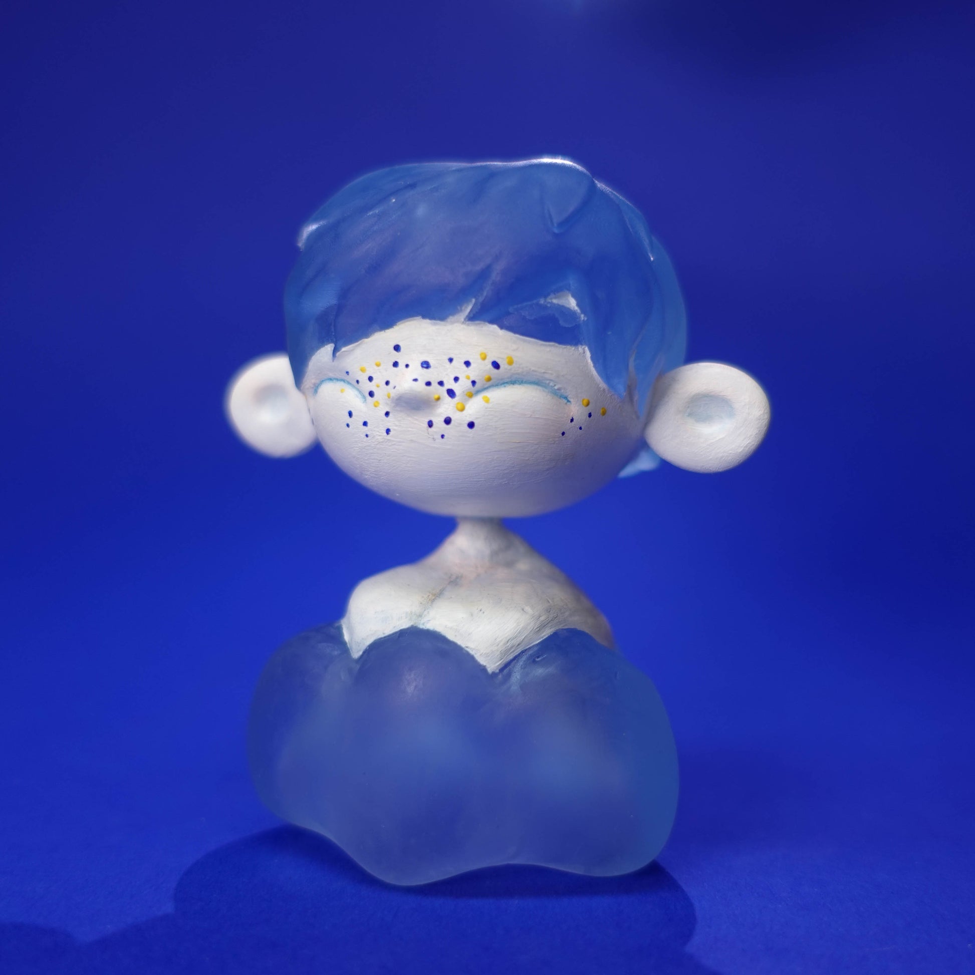 Small handmade Cloud Chaser sculpture with see-through blue “cloud” hair and body, 3D printed in resin, hand-painted and matte varnished, photographed on neutral background, one-of-a-kind.