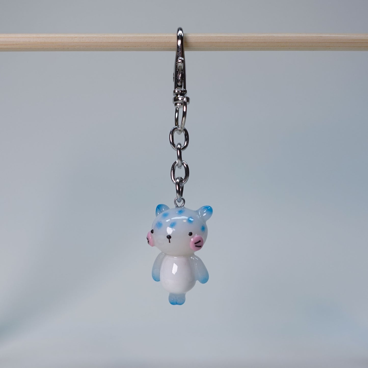 Blue pastel cat keychain handmade in soft tones with minimal cute cat features, limited edition statement charm for bags and keys.