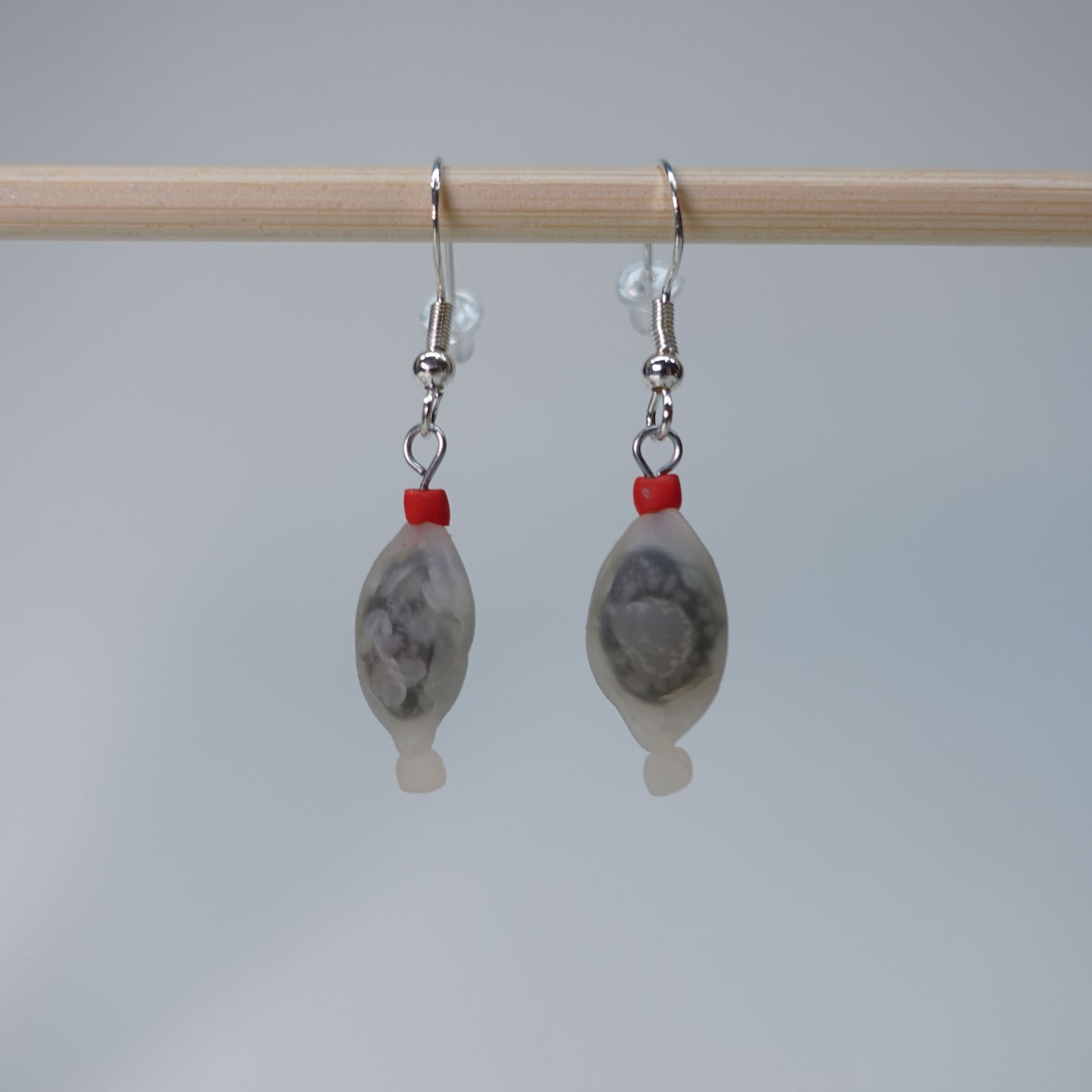 Handmade fish-shaped soy bottle earrings with matching salmon maki roll stud earrings, pastel sushi-themed set, limited edition, 4 sets available, playful accessory for daily wear.