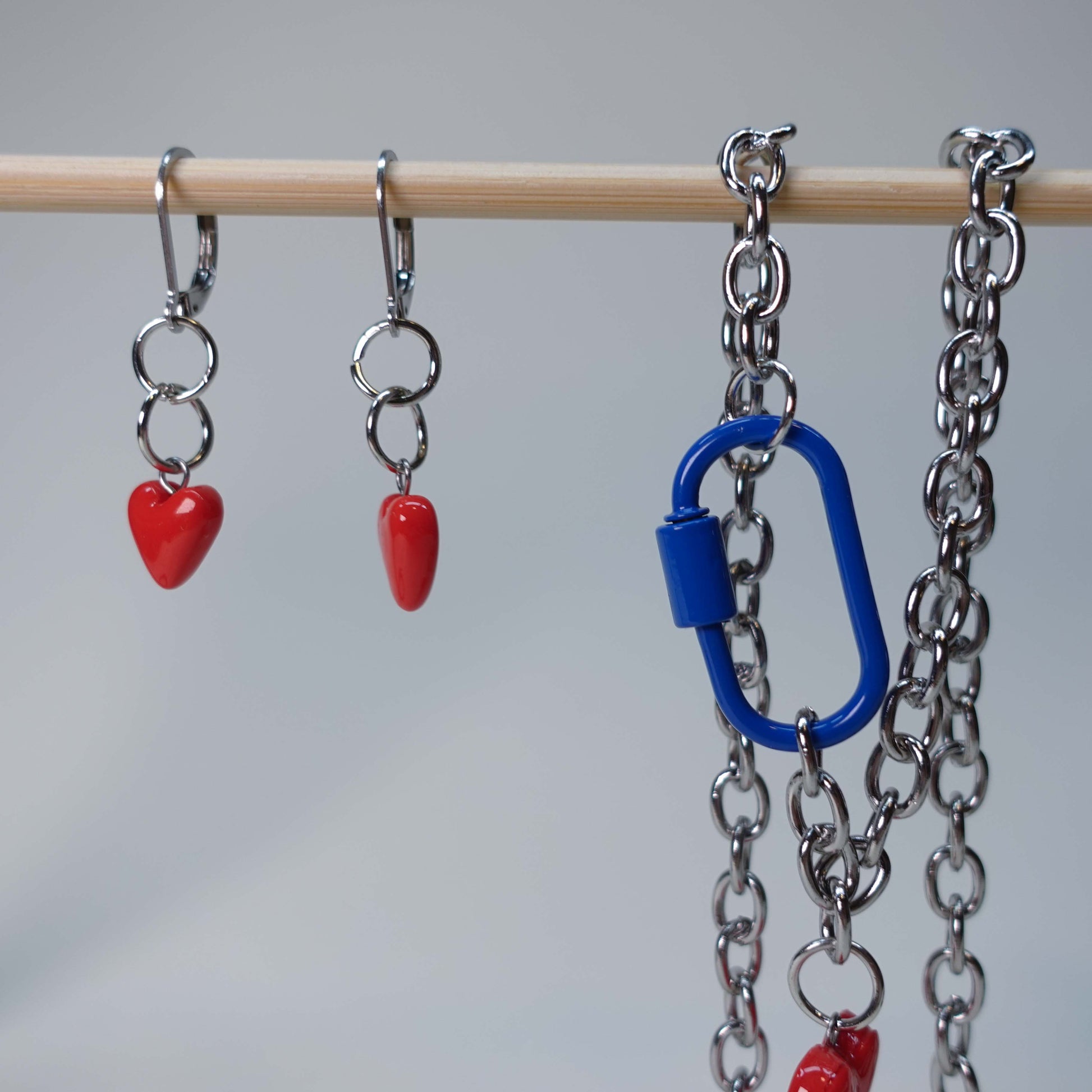 Handmade heart earrings paired with matching heart statement necklace/choker featuring a blue carabiner, pastel jewelry set, limited edition collectible accessory.