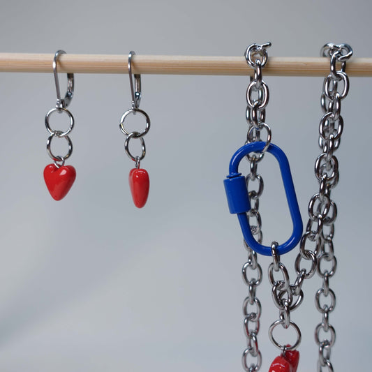 Handmade heart earrings paired with matching heart statement necklace/choker featuring a blue carabiner, pastel jewelry set, limited edition collectible accessory.