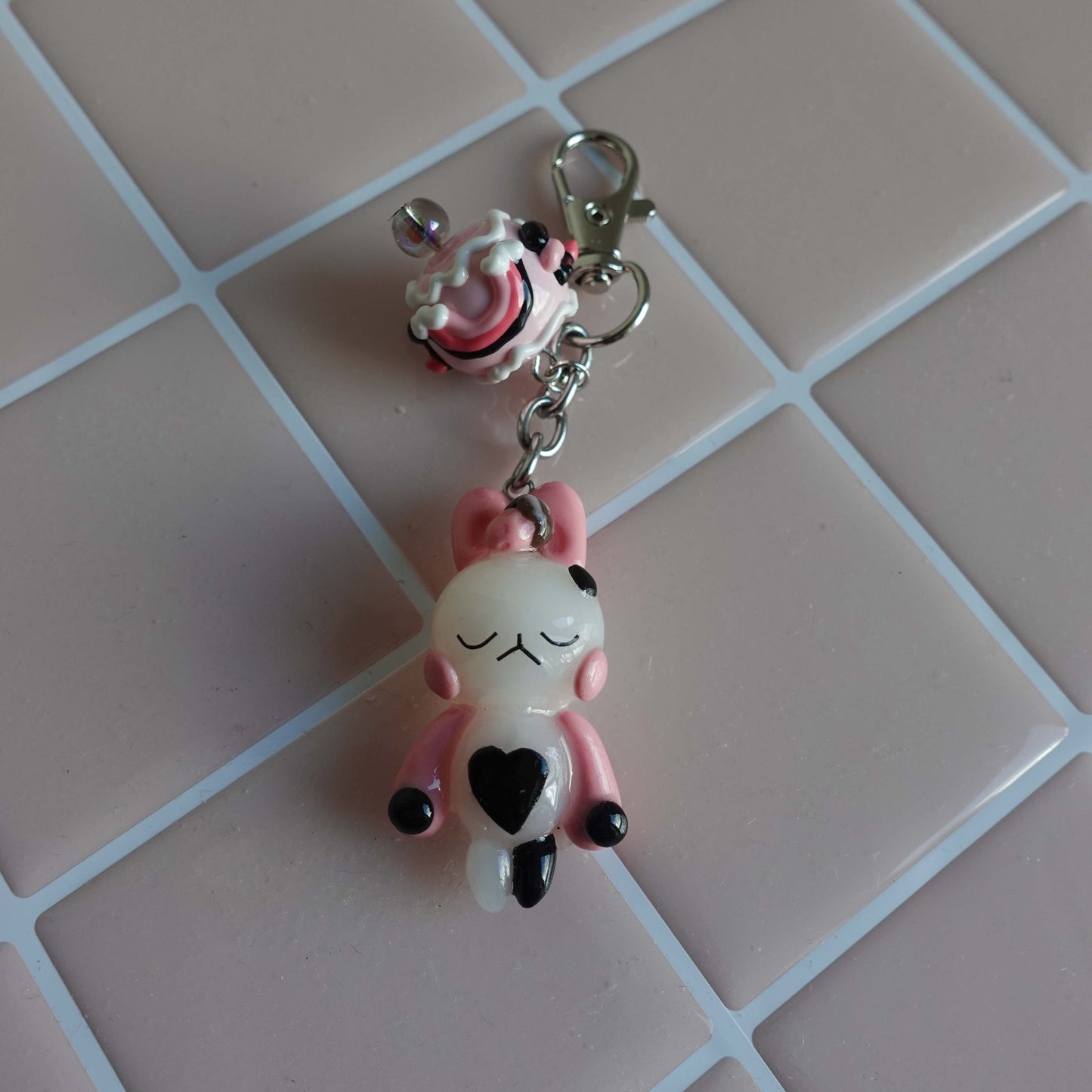 Pair of bunny-shaped keychains in soft pastel shades with magnetic bellies that 'click' together, symbolizing the connection and love shared with your significant other