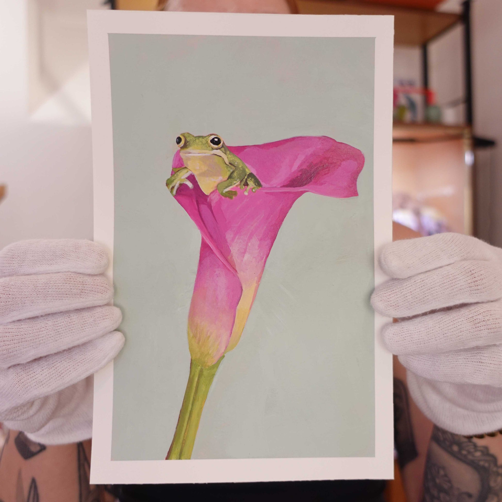 Original painting of a small frog sitting inside a blooming flower.